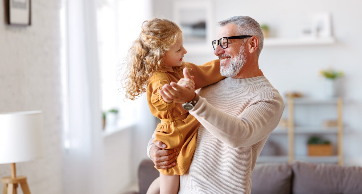 Happy grandfather Looking at his granddaughter